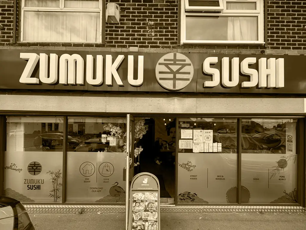 Zumuku Sushi storefront with installed brand graphics